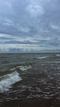 Waves rolling on the Baltic Sea coast. Seascape. Latvia photo