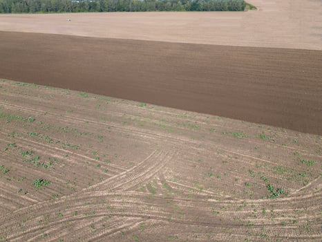 Plowed agricultural field, view from above, background. photo