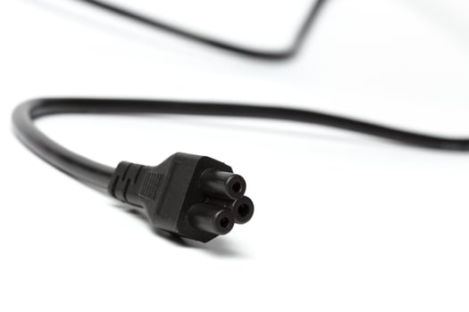 Black power cable with plug and socket isolated on white photo