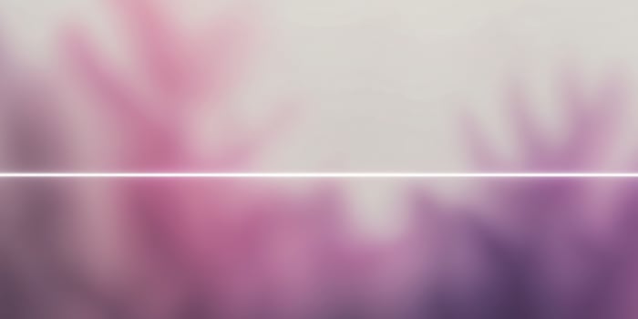 A purple and pink blurred background with a white border photo