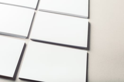 blank business cards on grey background photo