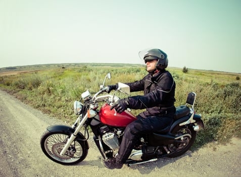 Biker on the country road photo