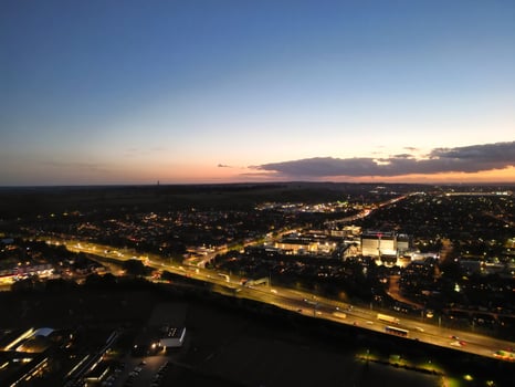 Most Beautiful High Angle View of Illuminated Luton City of England UK at Just After Sunset and Full Moon Night. Aerial Footage Was Captured with Drone's Camera on October 17th, 2024 photo