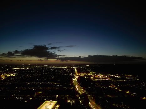 Most Beautiful High Angle View of Illuminated Luton City of England UK at Just After Sunset and Full Moon Night. Aerial Footage Was Captured with Drone's Camera on October 17th, 2024 photo