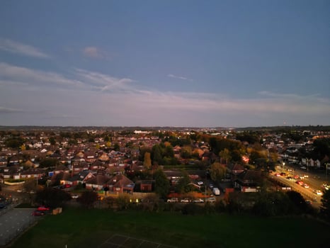 Most Beautiful High Angle View of Illuminated Luton City of England UK at Just After Sunset and Full Moon Night. Aerial Footage Was Captured with Drone's Camera on October 17th, 2024 photo