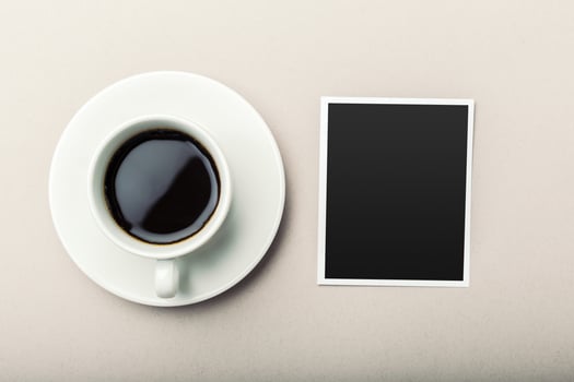 coffee and photo blank on the table.