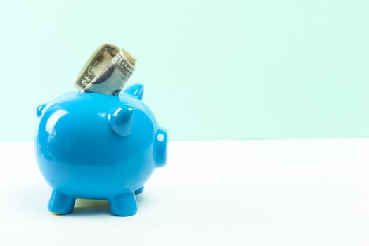 Blue piggy bank or money box photo