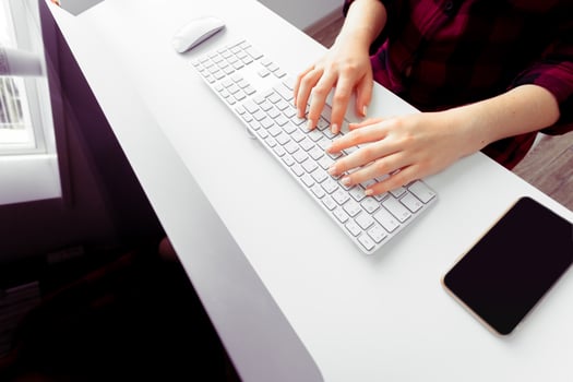 Hands of an office woman typing photo