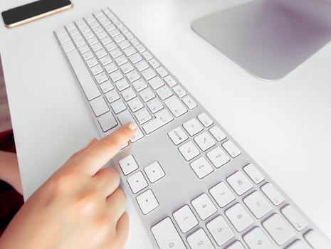 Hands of an office woman typing photo