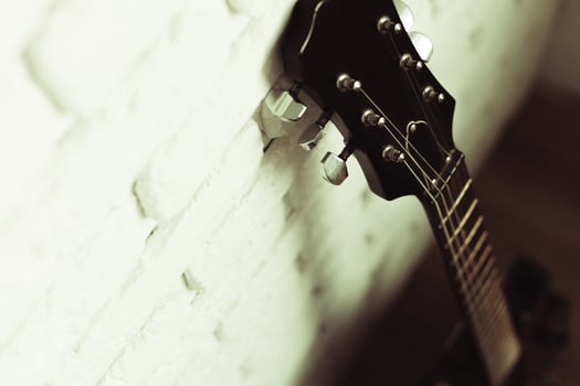 Electric guitar body and neck detail on wooden background photo