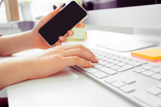 Hands of an office woman typing photo