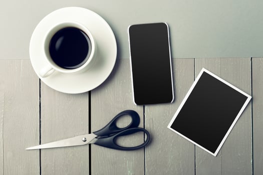 coffee and photo blank on the table.
