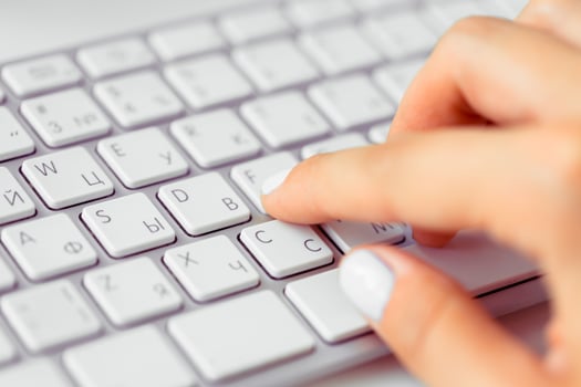 Hands of an office woman typing photo