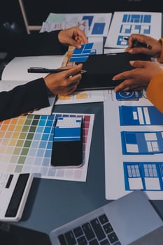The designer team is designing the uxui system to make the uxui system work well on new phones and support system updates. Website development concept UI UX front end designer photo