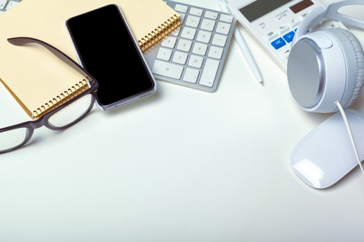 Office desk table with computer keyboard, supplies, calculator, pen, glasses photo