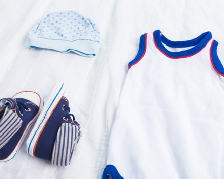 Baby boy clothes on white background photo