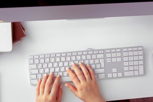 Hands of an office woman typing photo
