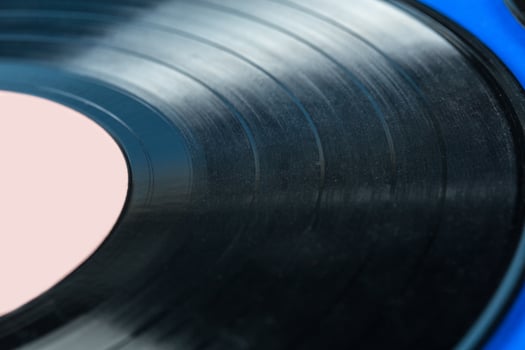 Retro vinyl record on blue background photo