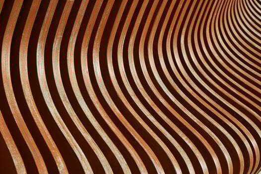 Brown wooden planks, fragment of a bench with curved geometry, vertical planks. Abstract background. photo