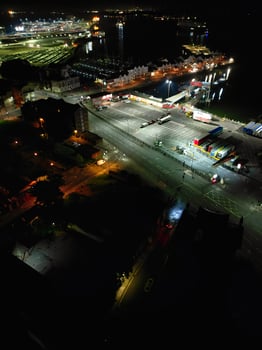 Aerial View of Illuminated Southampton Docks and Port City Centre During Dark Night. England United Kingdom. High Angle Drone's Camera Footage Captured from High Altitude on May 16th, 2024 photo