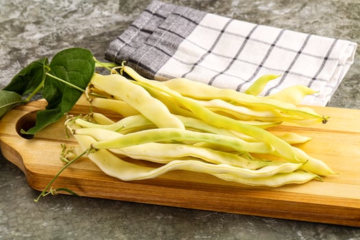 Raw green bean strings heap photo