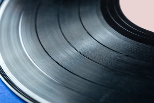 Retro vinyl record on blue background photo