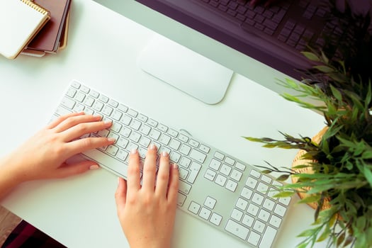 Hands of an office woman typing photo