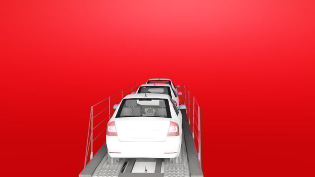 A car is driving on a red background photo