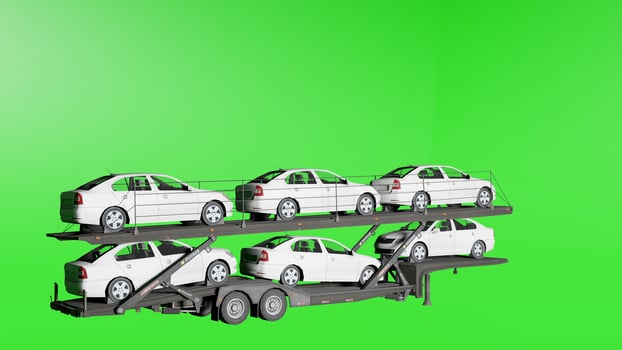 A white car trailer with four cars on it photo