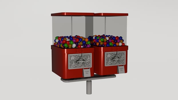 A red gumball machine with many different colored balls photo