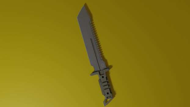 A knife is shown on a yellow background photo