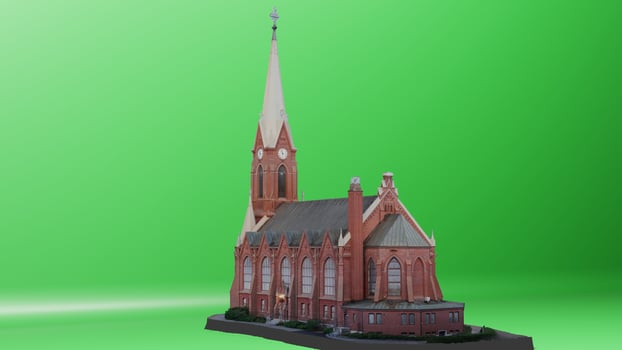 A model of a church on a green screen photo