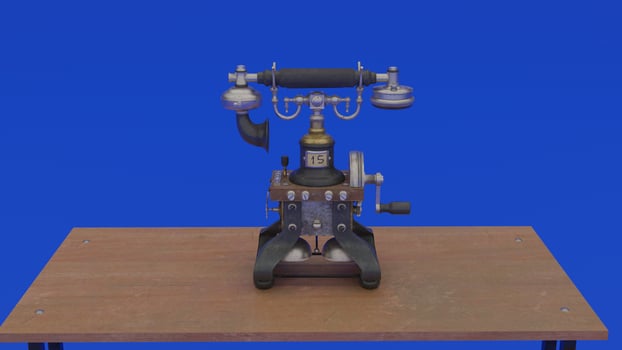 A telephone on a table with a blue background photo