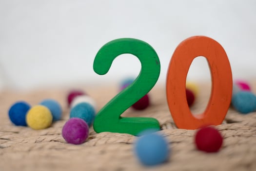 Close-up wooden figure number twenty on a white blurred background photo