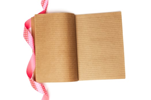 Notebook and red ribbon photo