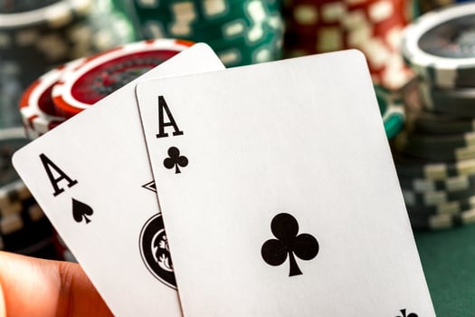 Cards and chips for poker on green table photo