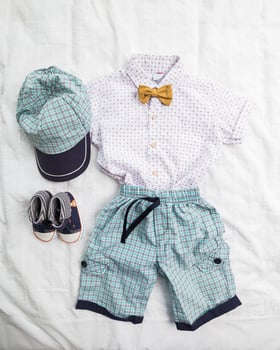 Baby boy clothes on white background photo