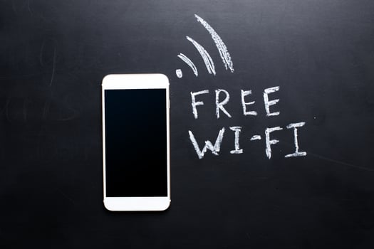 Wireless Symbol Drawn on a Blackboard near smartphone photo