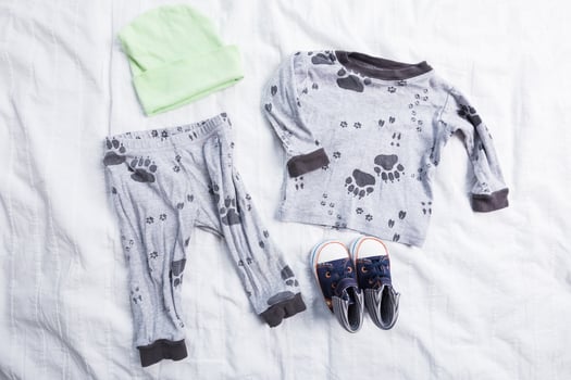 Baby boy clothes on white background photo