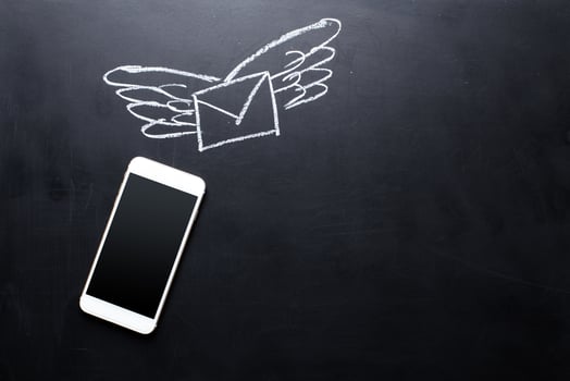 Smartphone on blackboard background photo
