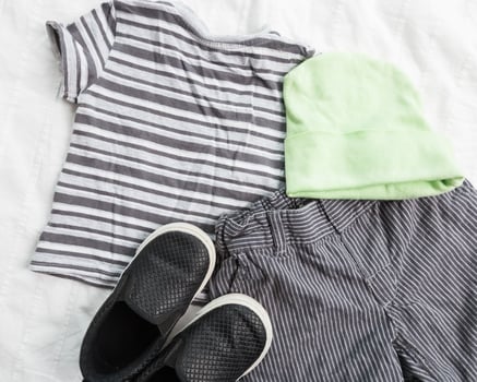 Baby boy clothes on white background photo