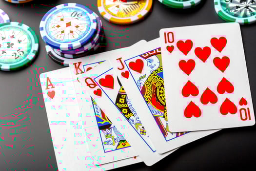 poker chips and cards on black background photo