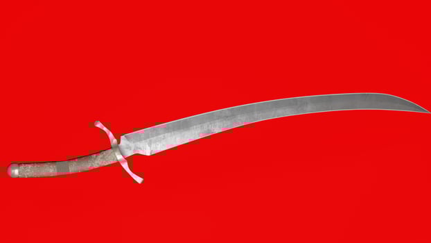 A large knife on a red background photo