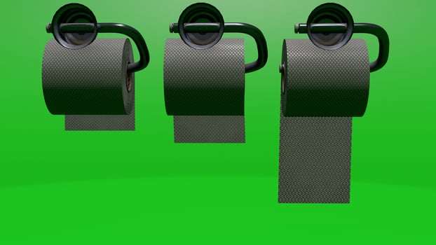 Three black rolls of toilet paper on a green background photo