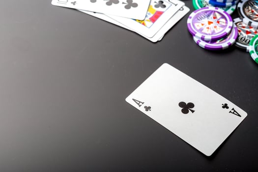poker chips and cards on black background photo