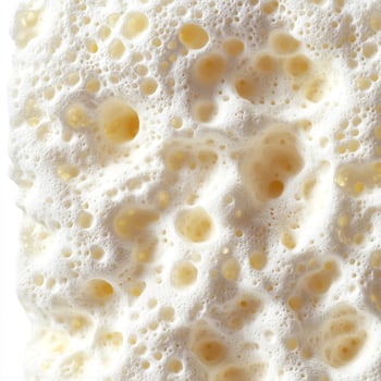 A close up of a foam sponge on a white surface photo