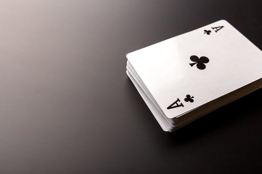 poker chips and cards on black background photo