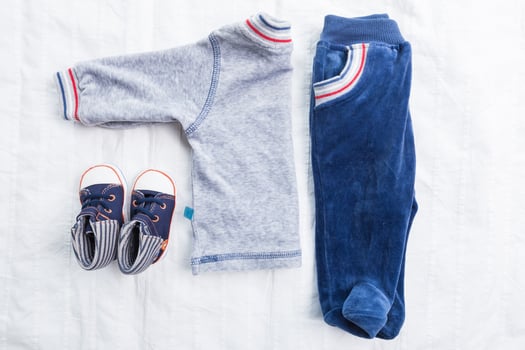Baby boy clothes on white background photo