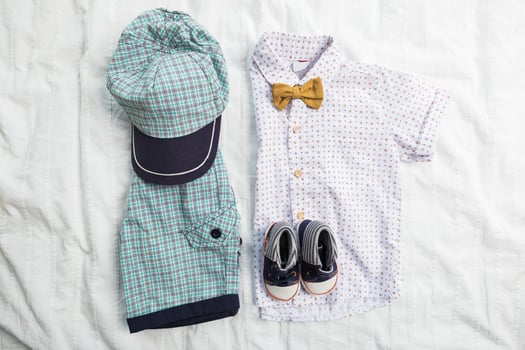 Baby boy clothes on white background photo