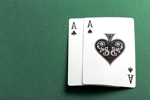 Cards and chips for poker on green table photo